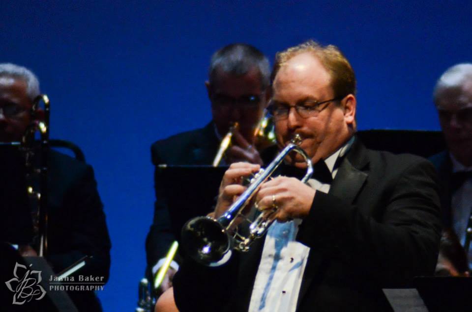 Phillip B. Pacier performing trumpet in a formal orchestral concert