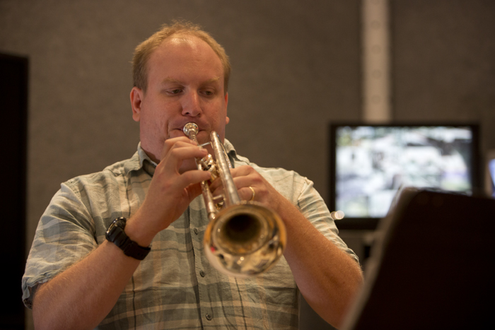 Phillip B. Pacier playing trumpet in a rehearsal setting