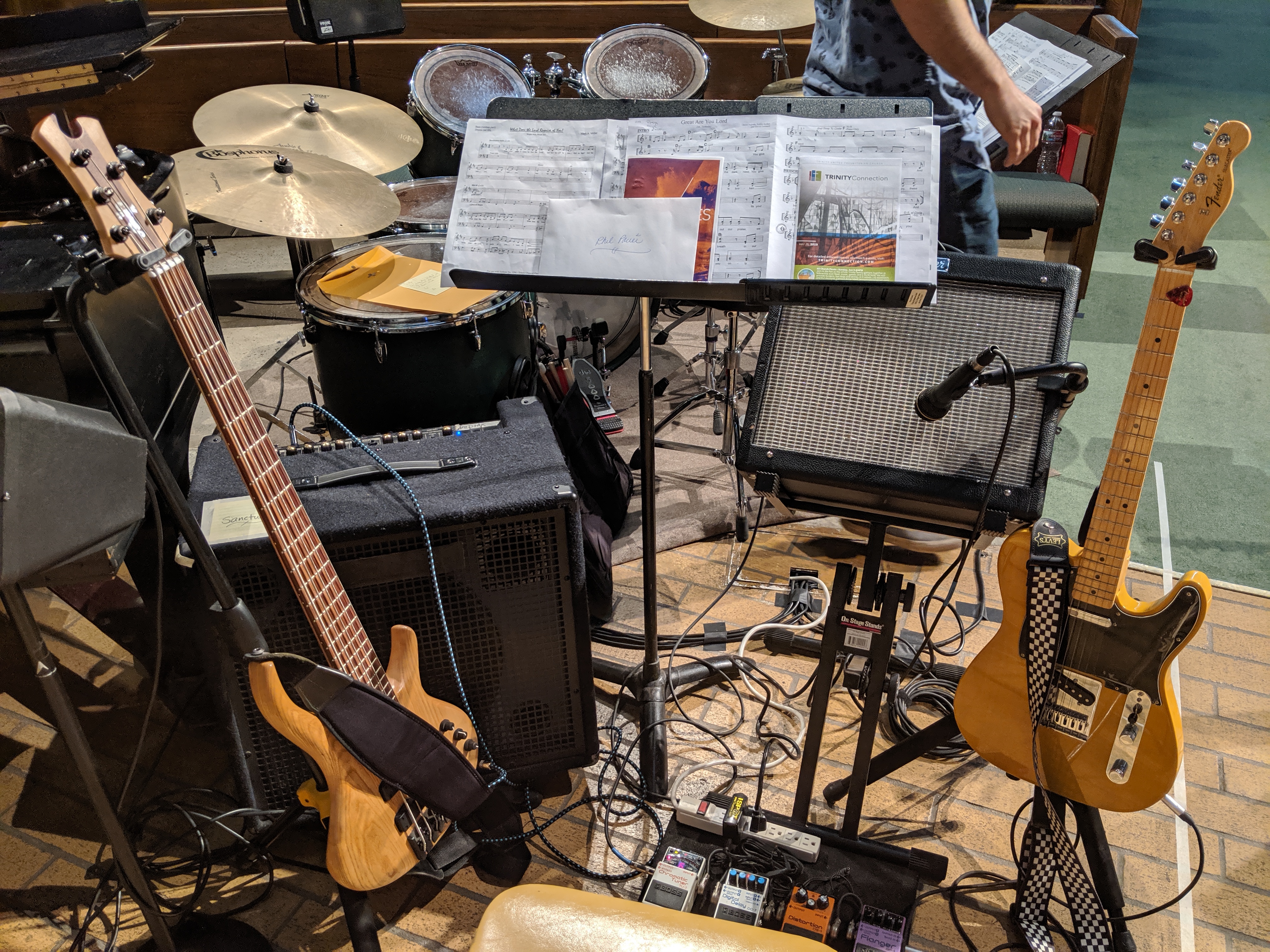 Electric bass and electric guitar prepared for performance